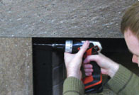 Drill a pilot hole on the pencil marks using the same 3/16 inch masonry drill bit.